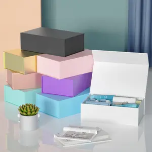 Kotak kertas hadiah magnetik mewah mode kustom daur ulang untuk pakaian hadiah kotak pakaian lipat kemasan mahkota menang