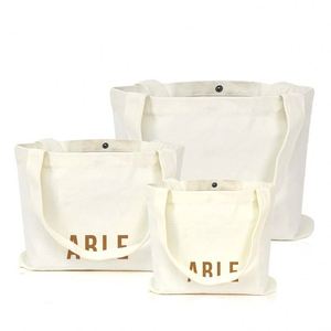 Bolsa de Compras de Lona con Impresión Personalizada, Botón de Presión Metálico, Asa Larga para el Hombro, Bolsillo Integrado, Refuerzo Cruzado - Product Image 1