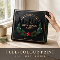 Boîte cadeau personnalisée noire de Noël avec cadre doré et sapins enneigés pour cadeaux d'entreprise de Noël