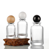30ML 50ML 100ML Botellas de perfume de vidrio redondas multiespecificación con 15 tapas de bayoneta empaquetadas en tapas de bola de madera de colores
