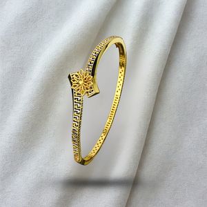 Gold Finish Designer Bangle with Floral Motif and Geometric Pattern Elegant Lightweight Jewelry <b>for</b> <b>Women</b> Ideal <b>for</b> Wedding - Product Image 1