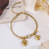 Bracelet en acier inoxydable à double cœur avec diamants, ne ternit pas, élégant et délicat, parfait pour un usage quotidien.