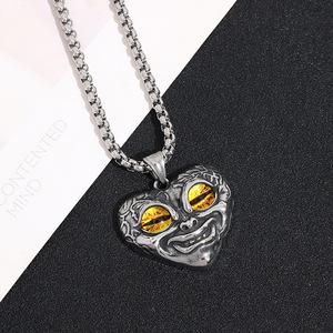 Yunnique – collier avec pendentif œil maléfique, visage de satan, en acier inoxydable, yeux rouge, bleu, vert, jaune, bijoux punk unisexes, design géométrique - Product Image 3