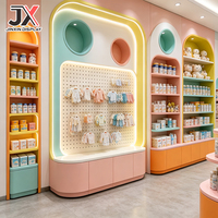 Ensemble d'étagères de présentation pour magasin de bébés, design personnalisé, étagères murales colorées pastel, produits pour bébés OEM, comptoir de vente au détail, solution clé en main