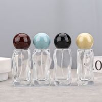 Bouteille de parfum vide en verre de 30ml en forme de vague au design unique, bouteille en verre rechargeable à brume fine pour huile essentielle cosmétique