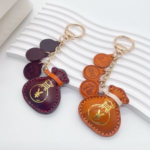 Porte-clés de luxe tendance en cuir véritable, porte-bonheur, pour sac à main, accessoire de sac, vente chaude - Product Image 1