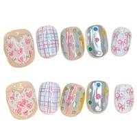 Ongles press-on faits main style niche, couleur macaron, motifs cœurs et nœuds, finition poudre miroir magique, lignes blanchissantes, amovibles