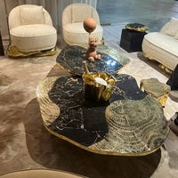 Table basse de luxe italienne moderne pour maison haut de gamme en acier inoxydable et marbre avec épissure légère Meubles de salon de style luxe