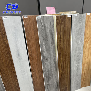 Plancher en vinyle SPC à prix d'usine, facile à installer, imperméable, ignifuge, écologique, design à grain plastique pour appartement - Product Image 1