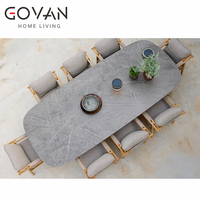 Nouvelle table à manger rectangulaire d'extérieur : mobilier de patio de luxe avec plateau en pierre et pieds en teck, idéal pour les hôtels de jardin
