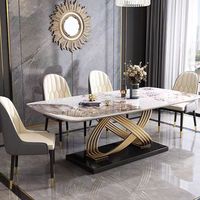 Ensemble de table à manger formelle moderne et luxueuse avec plateau en pierre blanche et base en acier doré, design pour 6 à 8 chaises