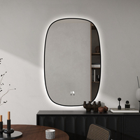 Miroir de salle de bain LED rectangulaire incurvé encadré, avec éclairage à intensité variable et fonction anti-buée