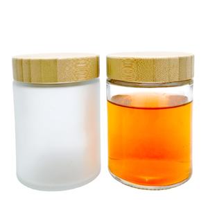 Tarro de vidrio redondo cilíndrico de lujo de 9 oz y 270ml, tarro de especias sellado para almacenamiento de alimentos con tapa de madera de bambú para té, <span class=keywords><strong>cacahuete</strong></span>, azafrán, sal marina - Product Image 1