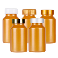 PET Orange Food Grade 200ml Suplemento Cápsulas de vitamina Tableta Botella de plástico con tapa superior abatible personalizada Tapa metálica