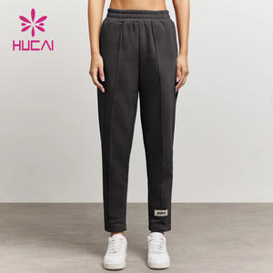 HUCAI OEM ODM Nylon Spandex Alto soporte Color liso Etiqueta personalizada Slim Fit Entrenamiento Fitness Pantalones de chándal para mujeres - Product Image 1