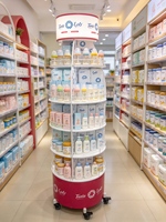Présentoir de vente au détail rotatif à 360° personnalisé avec boîte lumineuse et roulettes, présentoir multi-niveaux pour snacks, cosmétiques et produits pharmaceutiques