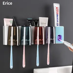 Vendita all'ingrosso tazza di plastica cremagliera dispenser-Dispenser automatico di dentifricio e portaspazzolino in plastica a parete per uso domestico con colore trasparente