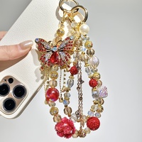 Chaîne de téléphone portable de luxe rouge et or avec papillon et rose – Charme éblouissant et élégant, idéal pour téléphones portables/porte-clés/sacs