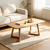 Table basse rectangulaire en bois massif moderne avec pieds creux en forme de V, design durable et profil bas pour salon
