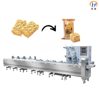 Machine d'emballage flow-pack pour confiseries au caramel avec neuf servomoteurs