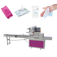 Machine d'emballage automatique de lingettes humides en sachets, type flow pack, pour lingettes humides avec trou de suspension sur les rayonnages de supermarché