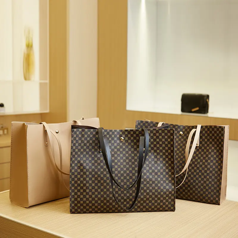 Vente en gros de sacs à main à bandoulière pour femmes logo personnalisé grande capacité en cuir artificiel sacs fourre-tout à la main pour femmes
