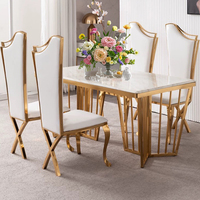 Luxueux grands dessus en marbre blanc ensembles de chaises de Table de mariage chaises en acier inoxydable motifs de fleurs en métal pour l'utilisation de l'hôtel à manger