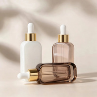 Flacon compte-gouttes en verre transparent de 50 ml à épaule plate avec logo personnalisé pour huile capillaire, sérum, gouttes pour les yeux, sérum de soin de la peau, emballage cosmétique
