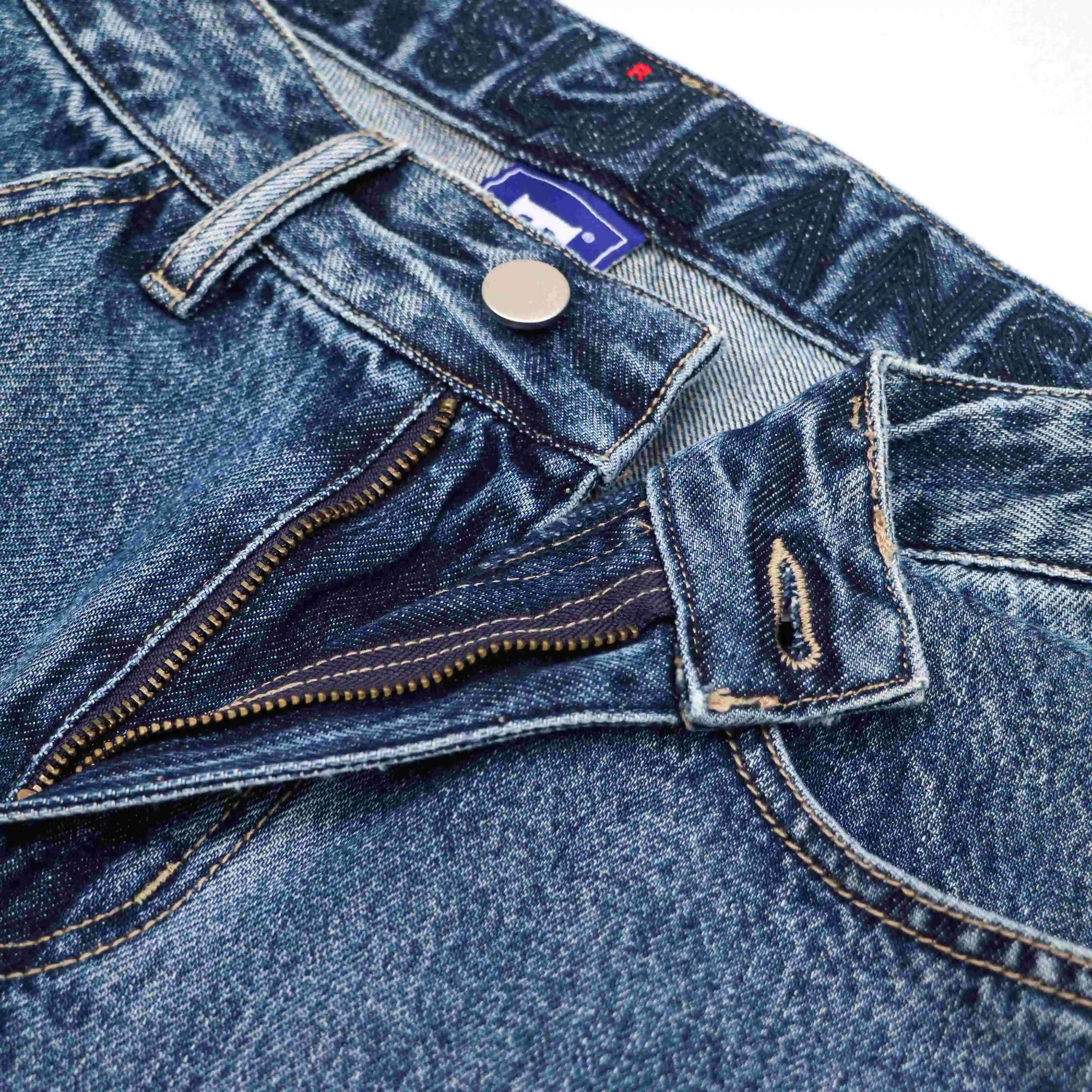 Autumn fashion design ripped stitching decoration blue mens denim jeans trouser With tassel