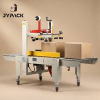 En stock Scelleuse de cartons automatique à bande latérale 110V 220V FXC5050X pour l'expédition e-commerce à haute vitesse Pro