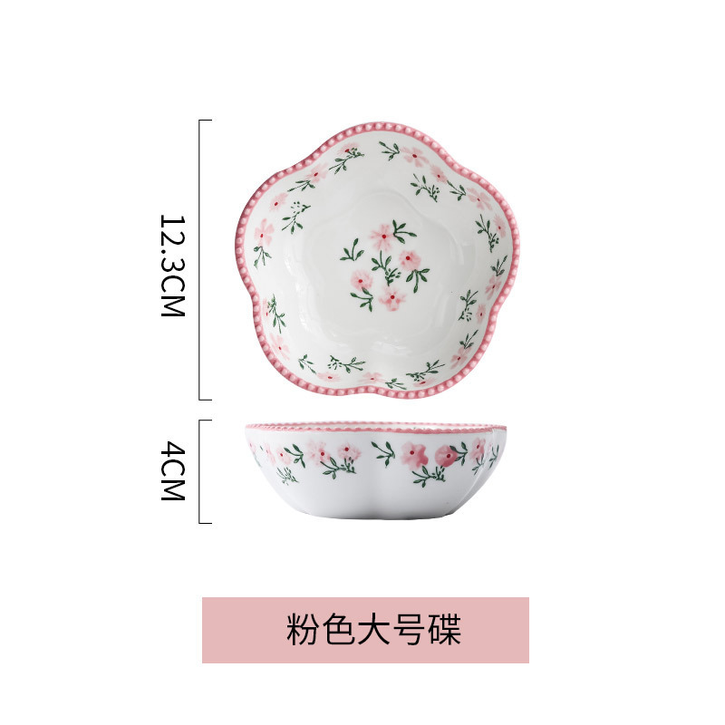 Plato grande con forma de flor de ciruelo, color rosa.