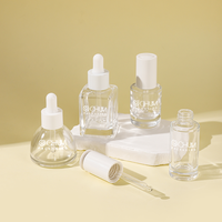 Özel silindirik kare konik şekli 30ml sıvı kozmetik cilt bakımı Serum Push Button cam damlalık şişe