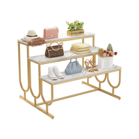 Présentoir de Magasin de Vêtements Moderne en Métal avec Base Dorée, Table à Escalier et Étagère à Chaussures pour Salon