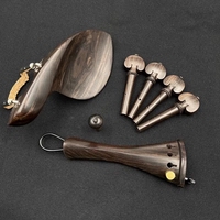 Ensemble d'accessoires pour violon 4/4 en ébène naturel - Comprend un repose-menton, des chevilles, une cordière, une patte arrière et un cordon de queue