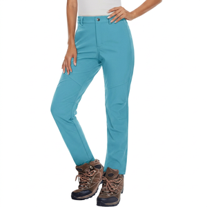 Pantalon de ski imperméable turquoise pour femme avec poches zippées et fermeture à boutons pour activités de neige en plein air - Product Image 1