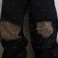 Streetwear surdimensionné noir personnalisé pour hommes ample 400 g/m² coton épais droit jambe large épissé impression numérique imprimé léopard jean