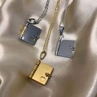 Nouveau design en acier inoxydable de bijoux étanches tendance pour mini couple livre d'amour médaillon pendentif collier