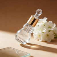 Vente en gros de flacons compte-gouttes en verre transparent personnalisables de 6 ml et 12 ml, en forme de gourde, pour huiles essentielles, avec bouchons compte-gouttes à col doré