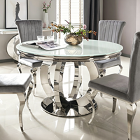 Table à manger élégante en acier inoxydable de luxe léger, moderne et minimaliste, en marbre, imperméable et durable, pour hôtel et usage domestique.