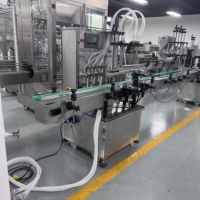 Machine de remplissage entièrement automatique à six têtes Zhongjie, commande PLC, levage de cylindres motorisé, pour les industries de l'eau, des aliments et des produits chimiques