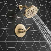 Système de douche en or brossé avec plaque frontale ronde, disque de buse noir, bras courbé, finition monocommande, vente en gros, usine OEM