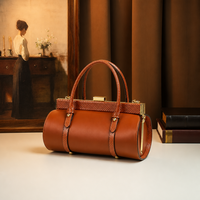 Sac cylindrique noir à imprimé serpent avec logo personnalisé, en cuir PU, fermoir à cadre métallique, sac à bandoulière et sac à main, fournisseur en gros