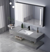 Meuble-lavabo mural en céramique intégré avec vasque en pierre frittée grise au design moderne, comptoir en pierre frittée pour usage hôtelier