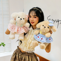 Peluche chien assis mignon avec robe à imprimé cœur, jouet en peluche doux pour filles, cadeau d'anniversaire pour enfants, décoration d'intérieur, vente en gros