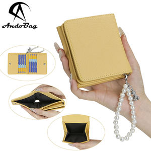 กระเป๋าสตางค์พับได้แบบพกพา AndoBag, กระเป๋าใส่เหรียญหนังแท้สำหรับผู้หญิง, ที่ใส่บัตรแฟชั่นพร้อมสายคล้องข้อมือประดับลูกปัด รุ่น 1936 - Product Image 1