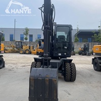 Pelle sur pneus Xinyuan C75W de 6,7 tonnes, bien entretenue, avec lame de bouteur avant, performances stables pour le creusement, garantie incluse