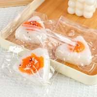 Jouet Squishy en forme de boule de riz jaune d'œuf en TPR, anti-stress, simulation alimentaire Onigiri, pour bureau, cadeau, vente en gros