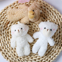 Ours en peluche à grosse tête, peluche courte et coton PP, emballage en sac en filet, accessoires de bouquet, pendentif
