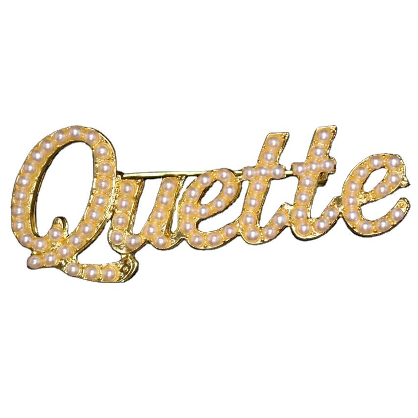 Broche perle quette dorée