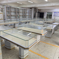 Vitrine à bijoux de luxe en acier inoxydable avec étagères multi-niveaux et présentoir à bijoux pour la vente au détail